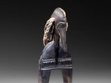 an image of a statue of a horse with a long mane