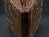 a book that is open on a black surface