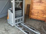 a picture of a forklift truck parked in a garage