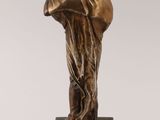 an image of a bronze statue of a woman on a marble base