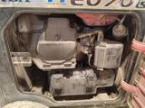 an image of a tractor engine in the back of a truck