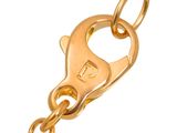 a close up of a gold chain with a key on it