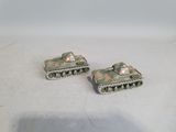 two toy tanks that are sitting on a table