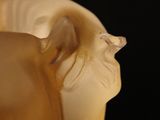 a close up of a statue of a horse on a black background