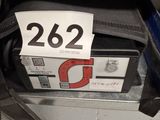 a bag with a price tag on it sitting on a shelf