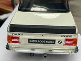 a model of a bmw 2000 turbo car on a table