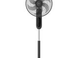 a black fan on a stand with a white background