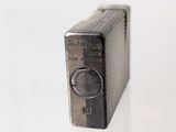 a small metal object that is on a glass table