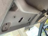 a close up of a car door handle with holes in it