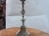 a lamp that is sitting on a table with a pink shade