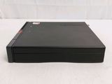 the back side of a black dvd player sitting on top of a white surface