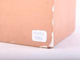 a brown box with a sticker on the side of it
