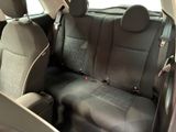 the back seats of a car are black and grey in color