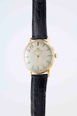 a close up of a watch on a black strap on a white background