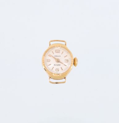 une image représentant une montre en or avec un cadran blanc