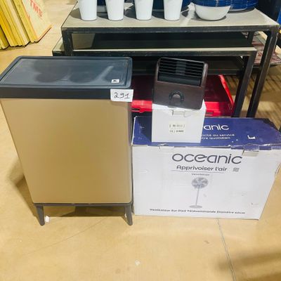 a box of coffee cups on the floor next to a box of coffee cups