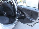 a car door open with the driver ' s seat up