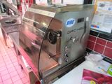 a machine that is sitting on a counter in a restaurant