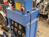 a blue machine that is sitting in a garage
