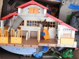 a toy house that is in a cardboard box