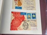 an open book with stamps on it sitting on a table