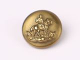 a gold button with a horse and rider on it