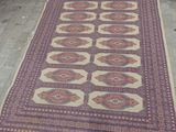 two rugs are laid out on the floor in a room