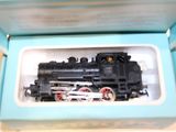 a toy train in a blue box on a table