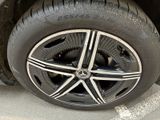 a close up of a tire on a car ' s rim