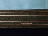 a close up of a black and blue wallet with a gold logo