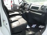 a white van with the door open sitting in a parking lot