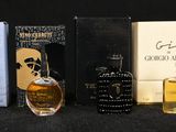 many different types of perfumes on a black background