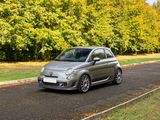 a small car that is driving down the road
