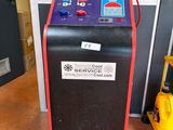 an image of a machine that is sitting in front of a door
