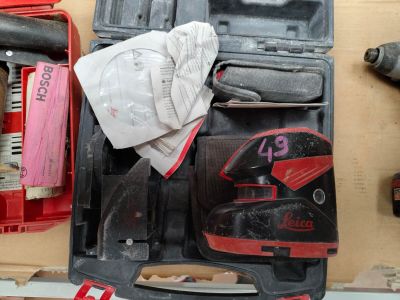 a tool box with tools and a pair of shoes in it