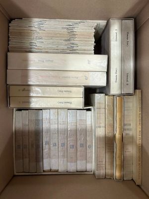a lot of books in a box on the floor