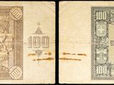un ancien billet d'un dollar et un nouveau billet d'un dollar, avec en arrière-plan l'image d'une tour horloge