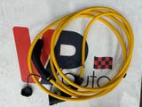 a yellow hose that is connected to a black cord