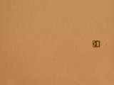 a cardboard box with a piece of paper on top of it