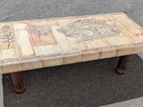 a wooden table that has a picture on it