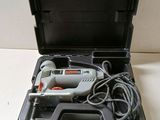 an image of a corded drill in a case with a cord