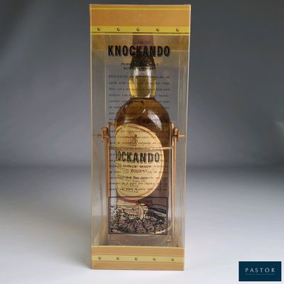 an image of a bottle of whisky in a clear box