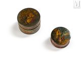 pair of small wooden boxes with paintings on them sitting on a white surface