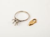 a gold and silver ring with a horse on it