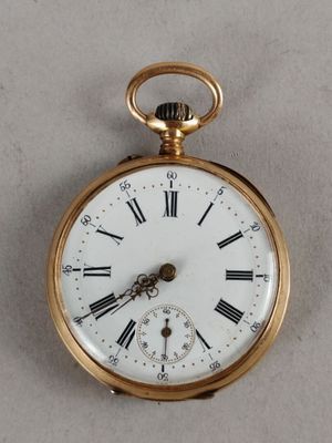 a gold pocket watch with roman numerals on it