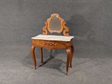 a small wooden table with a mirror on top of it