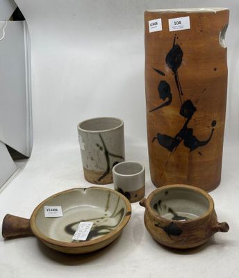 a lot of pottery on display on the table