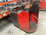 a forklift with a red seat in a warehouse