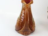 two vases that are sitting next to each other on a table