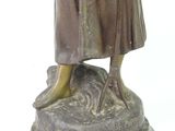 bronze statue of a woman holding a baby on a marble base